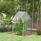 Serre transparente abritant une plante haute au jardin