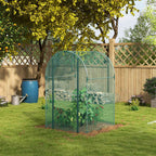 Cage fruitière verte avec cultures près d’un treillage