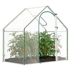 Serre transparente avec plantes et porte à fermeture éclair