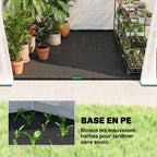 Tapis de sol noir dans une serre blanche contenant des plantes en pots