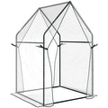 Petite serre transparente avec deux pans de porte attachés
