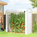Serre blanche abritant des tomates dans le jardin