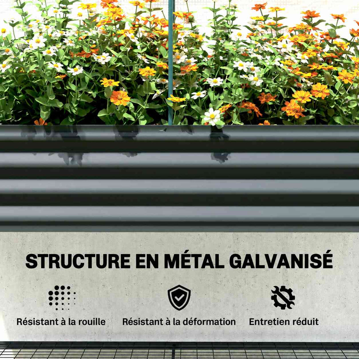 Détail du bac potager en métal gris rempli de fleurs