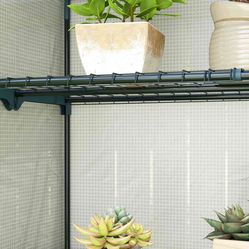 Gros plan sur une étagère grillagée et les plantes de la serre de balcon