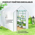 Porte enroulée et fenêtres grillagées de la serre blanche