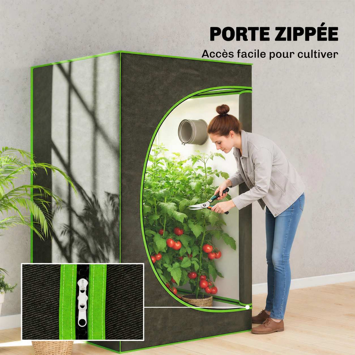 Femme entretenant les plantes par la porte zippée de la chambre de culture