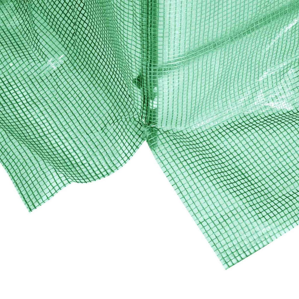 Fermeture zippée ouverte au bas de la bâche de serre verte