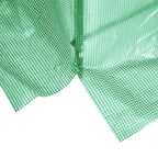 Fermeture zippée ouverte au bas de la bâche de serre verte