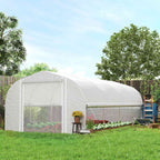 Grande serre tunnel blanche avec paroi latérale relevée dans le jardin