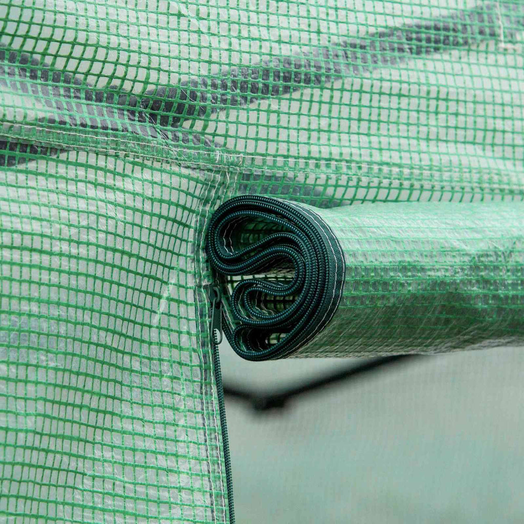 Gros plan d’un volet de fenêtre vert enroulé