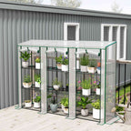Serre de balcon blanche remplie de plantes sur une terrasse