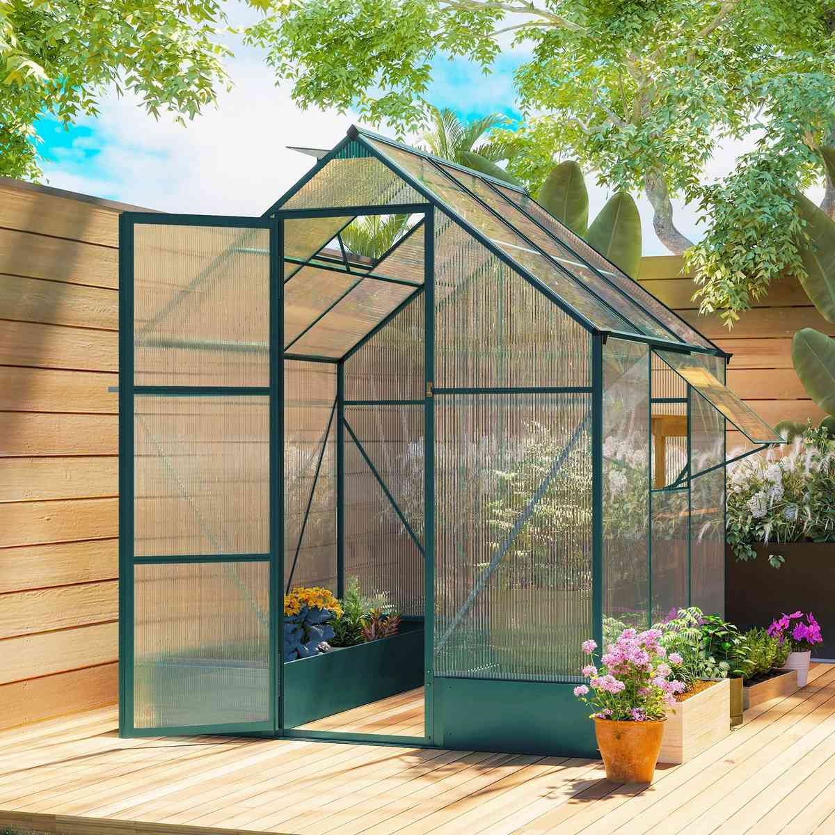 Serre verte avec bacs de culture sur une terrasse en bois