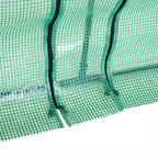 Fermetures zippées sur la bâche verte de la mini-serre