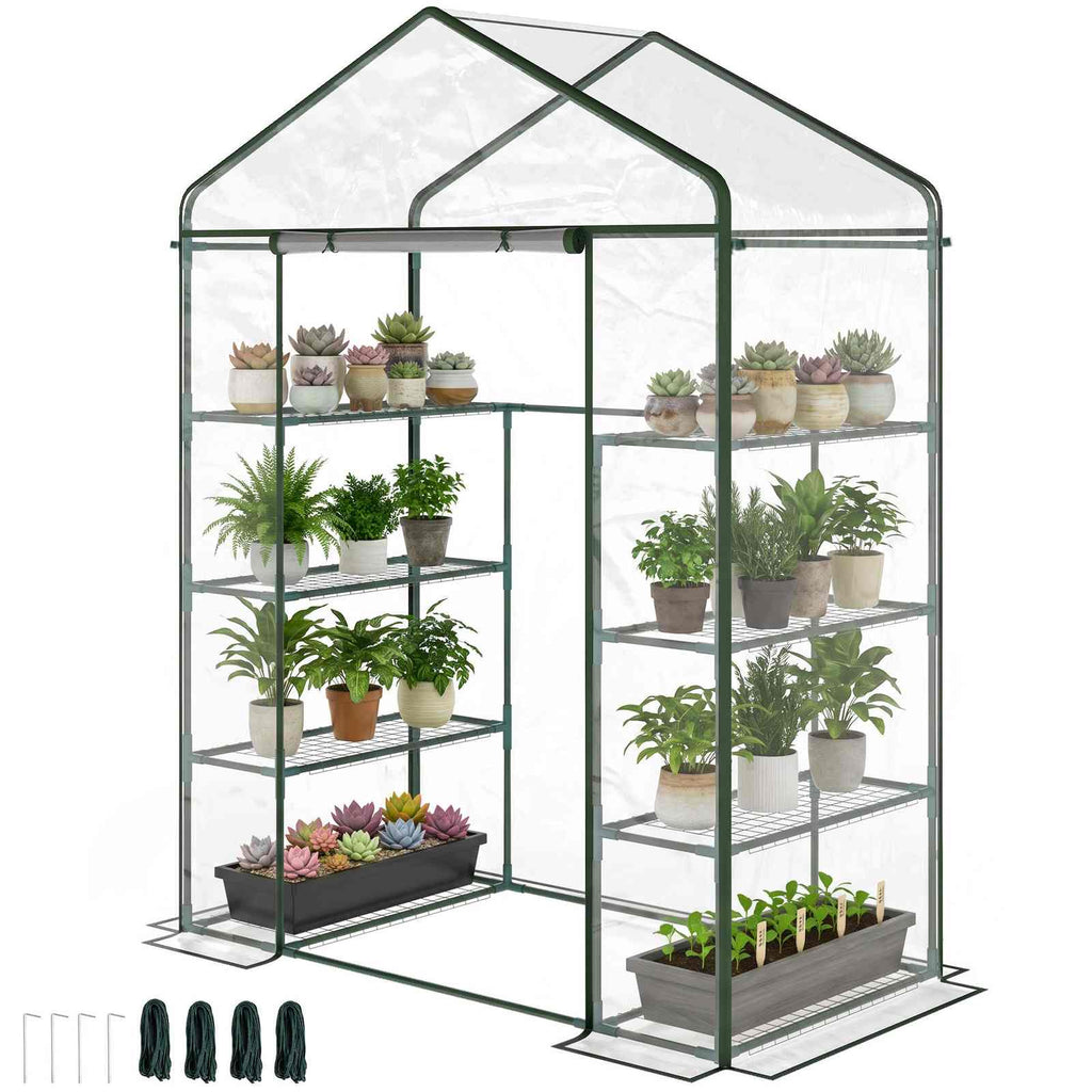 Serre transparente avec plantes en pots et piquets d’ancrage fournis