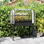 Bac potager noir sur pieds avec serre et fleurs dans le jardin