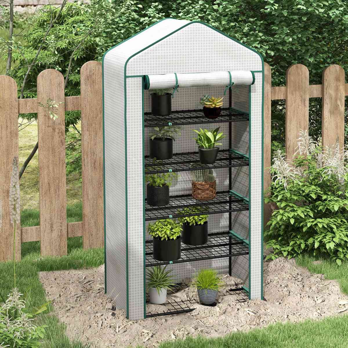 Serre blanche à cinq niveaux avec plantes au jardin