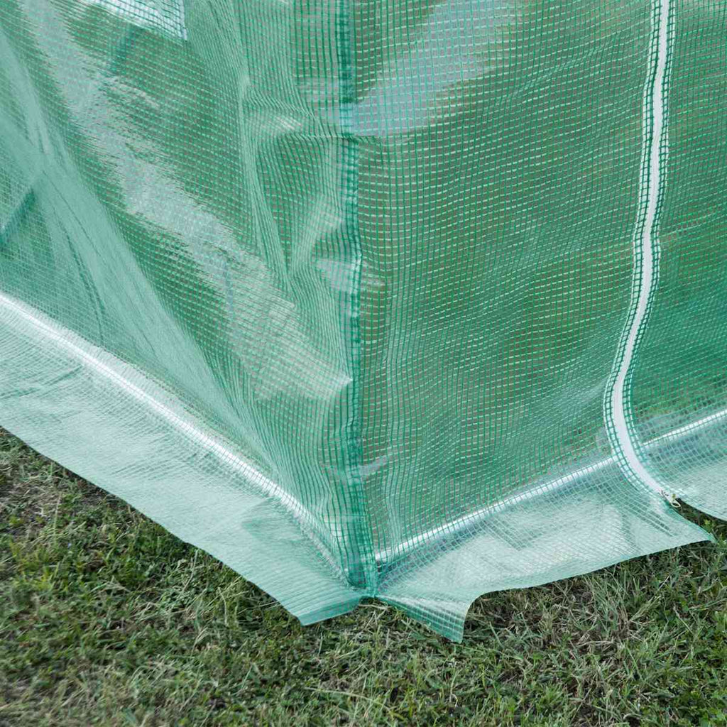 Angle inférieur de la bâche verte de serre avec bord prolongé