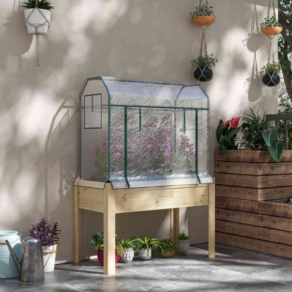 Potager sur pieds avec serre fleurie sur une terrasse