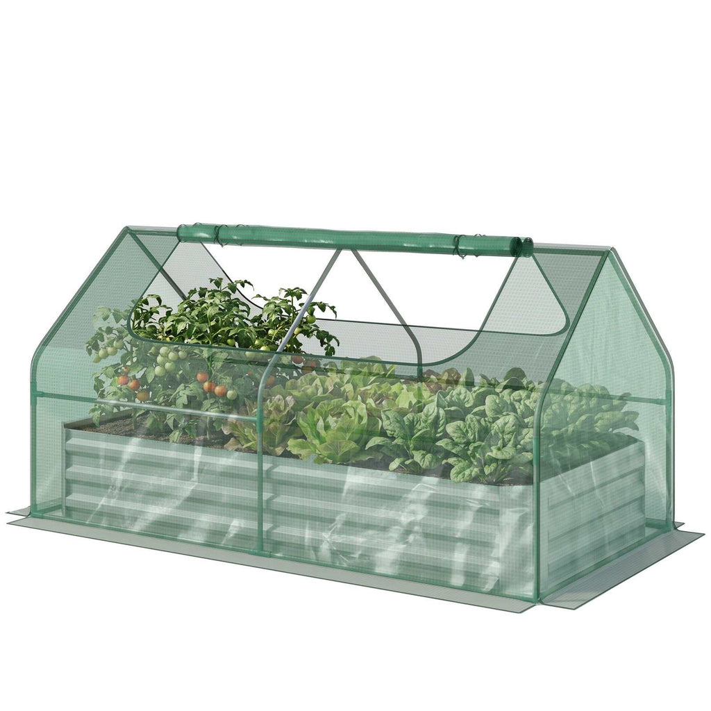 Serre verte sur bac potager avec tomates et aromates