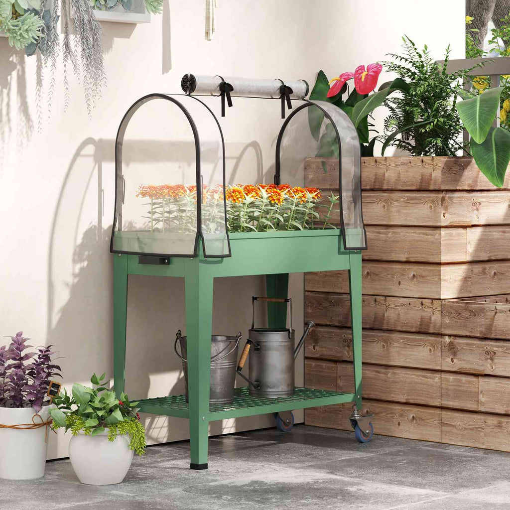 Bac potager vert avec serre et fleurs sur une terrasse
