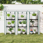 Serre de balcon transparente remplie de plantes sur une pelouse