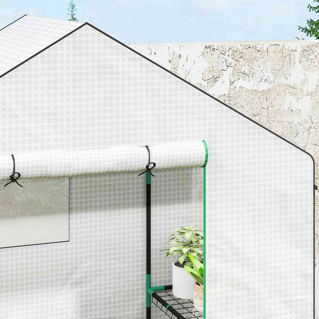 Détail du haut de la porte enroulée de la petite serre blanche