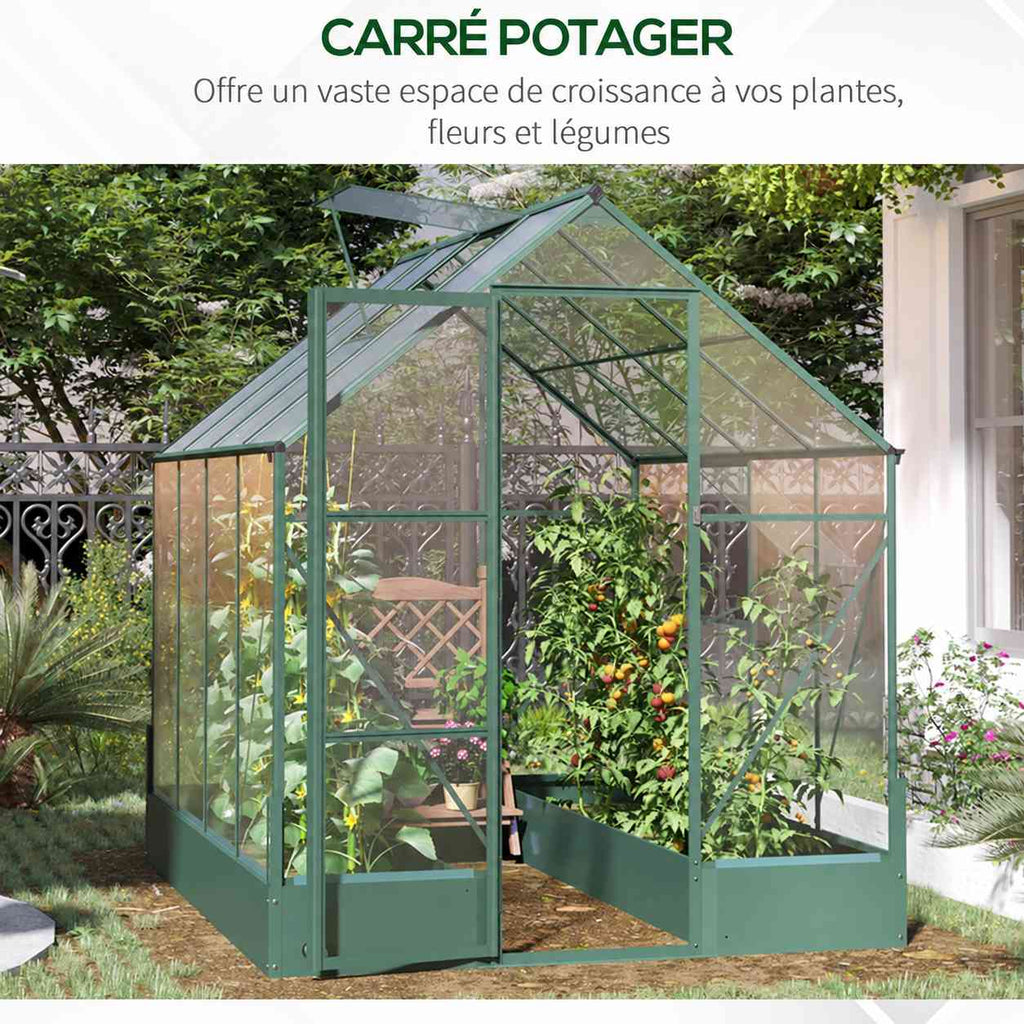 Deux bacs de culture garnis de plantes dans la serre verte