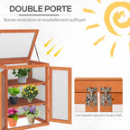 Double porte ouverte de la serre en bois avec détail des loquets