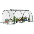 Mini serre tunnel transparente abritant des plantes en pots