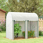 Serre blanche avec aubergines et tomates au jardin